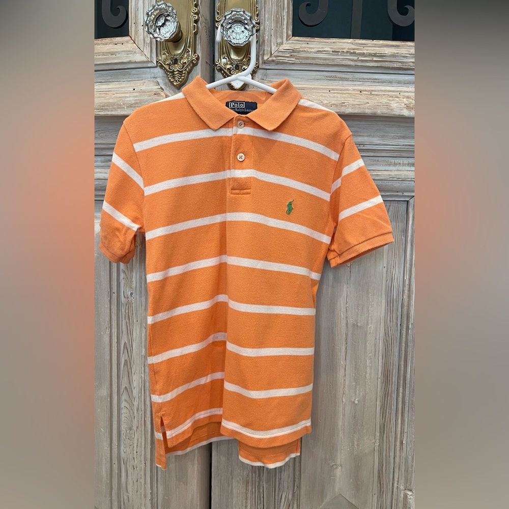 Polo by Ralph Lauren 
Boys size 7
Light orange with Green Horse